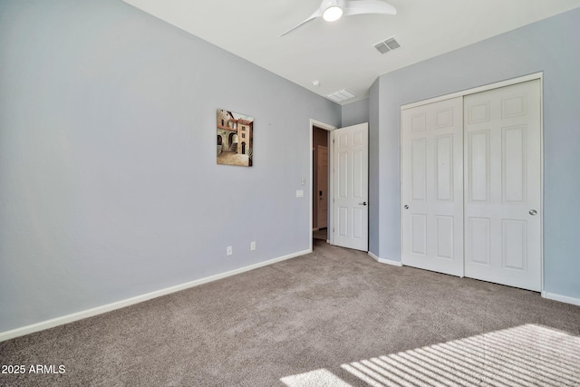 unfurnished bedroom with ceiling fan, visible vents, baseboards, a closet, and carpet