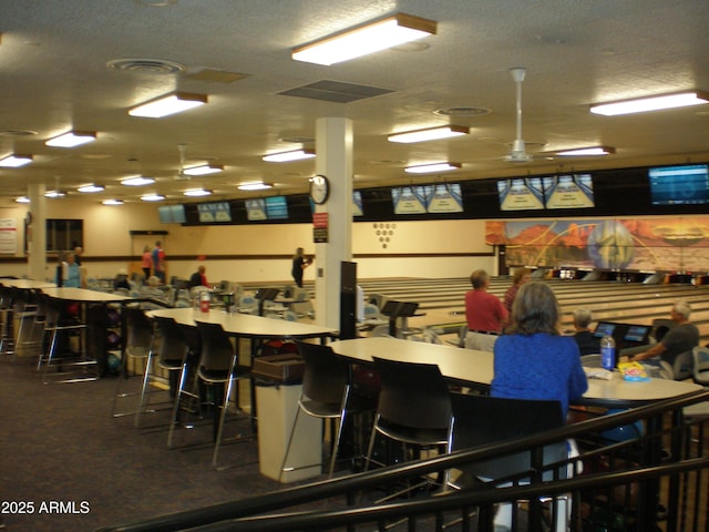 interior space with ceiling fan