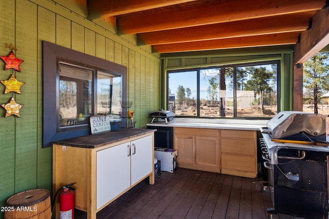 wooden deck featuring a grill