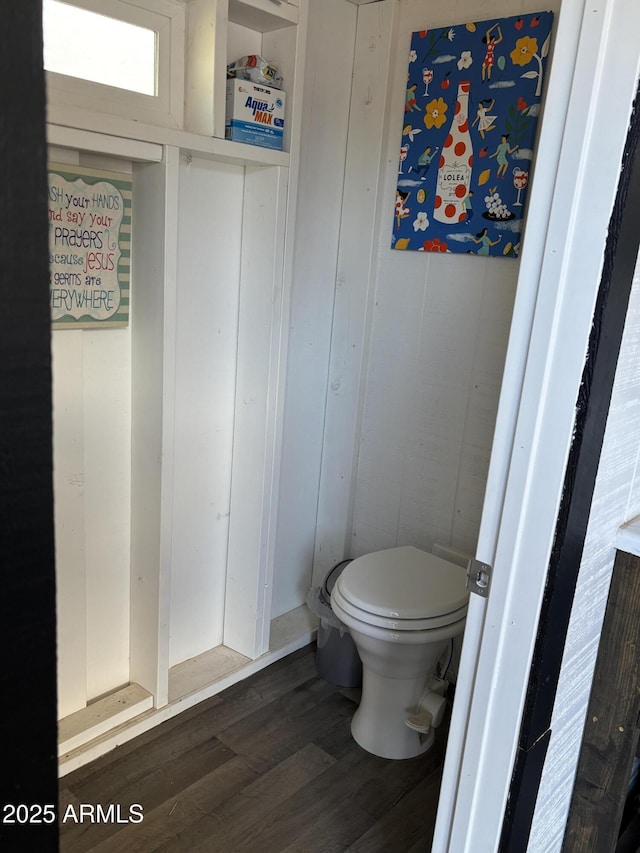 bathroom featuring toilet and wood finished floors