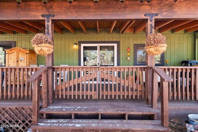 doorway to property featuring covered porch