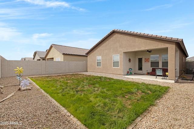 back of house featuring a patio, a fenced backyard, and stucco siding