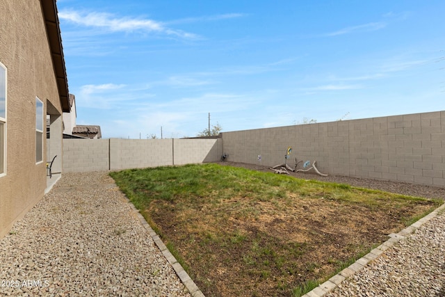 view of yard with a fenced backyard
