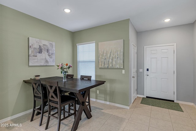 dining room with light tile patterned floors, recessed lighting, and baseboards