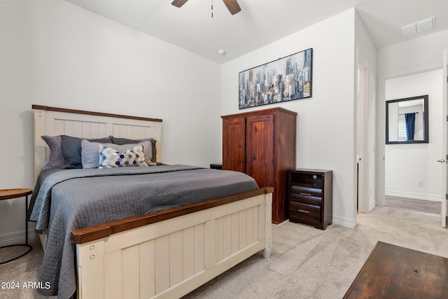 bedroom featuring light colored carpet and ceiling fan