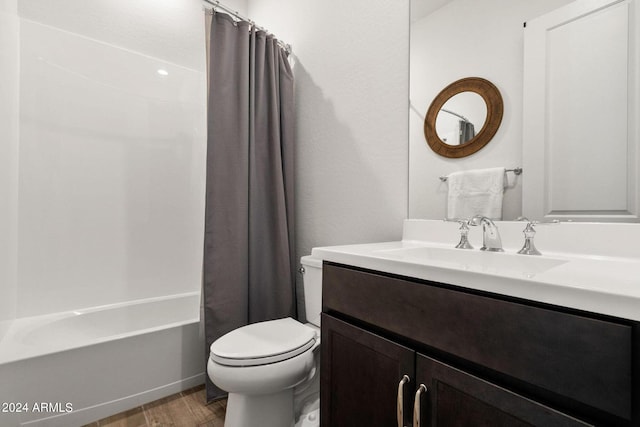 full bathroom with oversized vanity, hardwood / wood-style flooring, toilet, and shower / bathtub combination with curtain