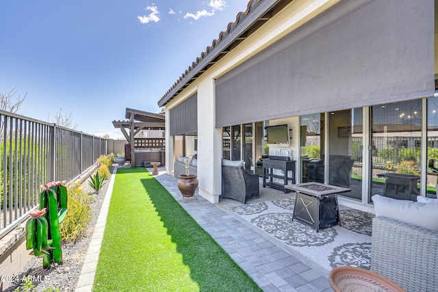 view of yard featuring an outdoor living space with a fire pit, a patio, and a pergola