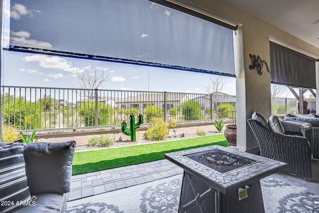 view of terrace featuring an outdoor fire pit