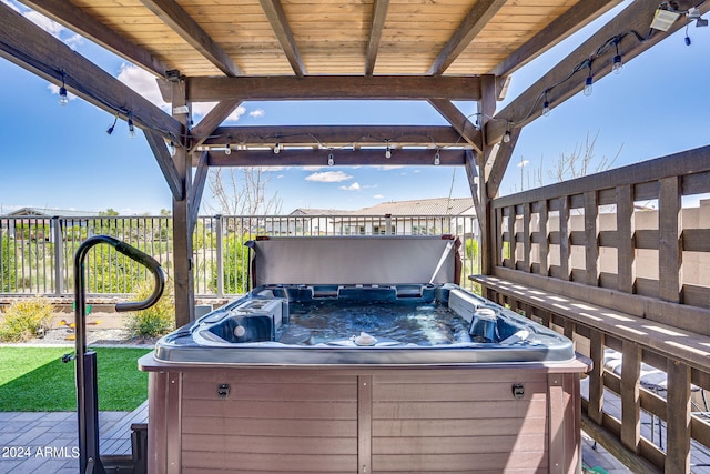 wooden deck with a hot tub