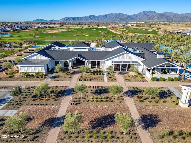 birds eye view of property with a mountain view