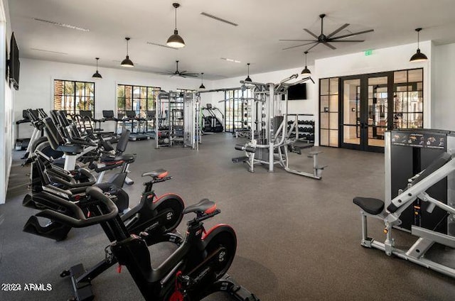 workout area featuring french doors and ceiling fan