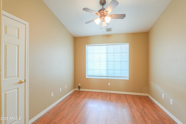 unfurnished room featuring ceiling fan and wood-type flooring