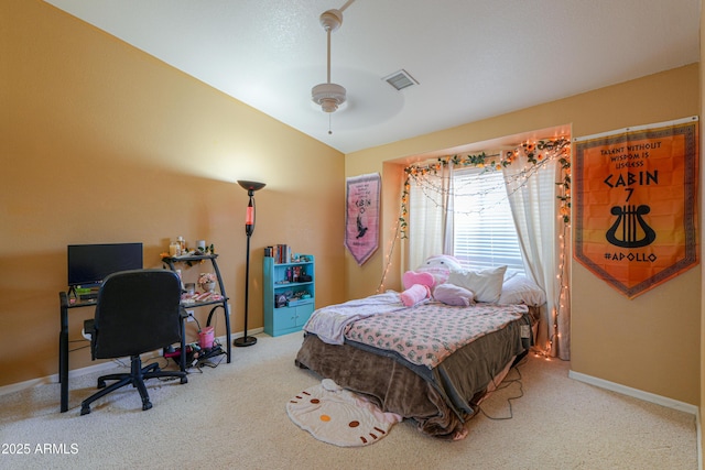 bedroom featuring light carpet, vaulted ceiling, and ceiling fan