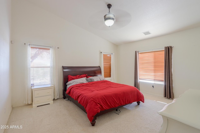 carpeted bedroom featuring ceiling fan and vaulted ceiling