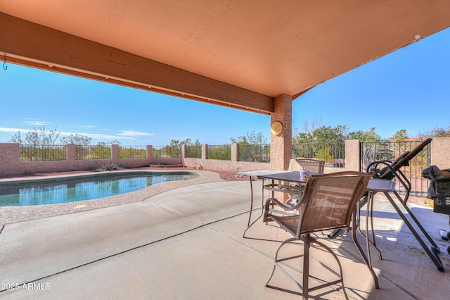 view of patio with a fenced in pool