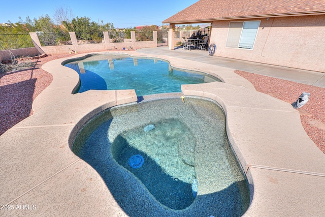 view of pool featuring an in ground hot tub and a patio area