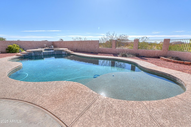 view of swimming pool featuring an in ground hot tub