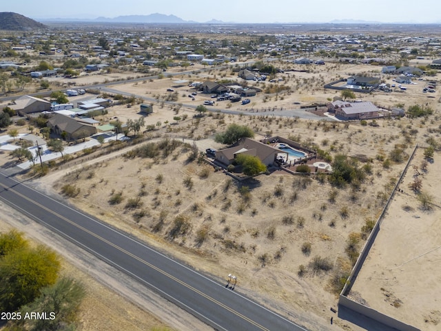 birds eye view of property with a mountain view