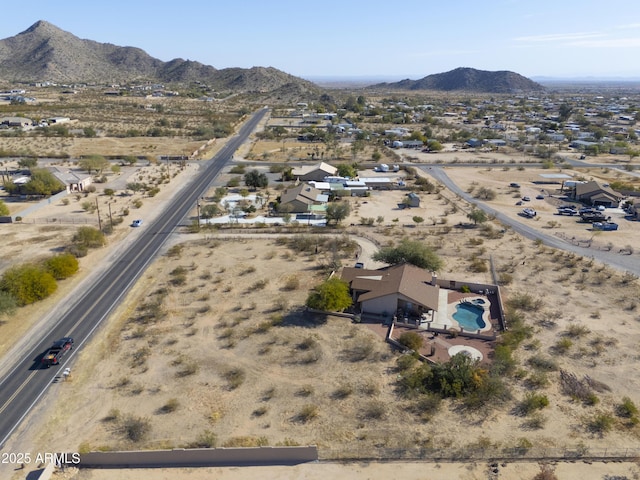 birds eye view of property featuring a mountain view