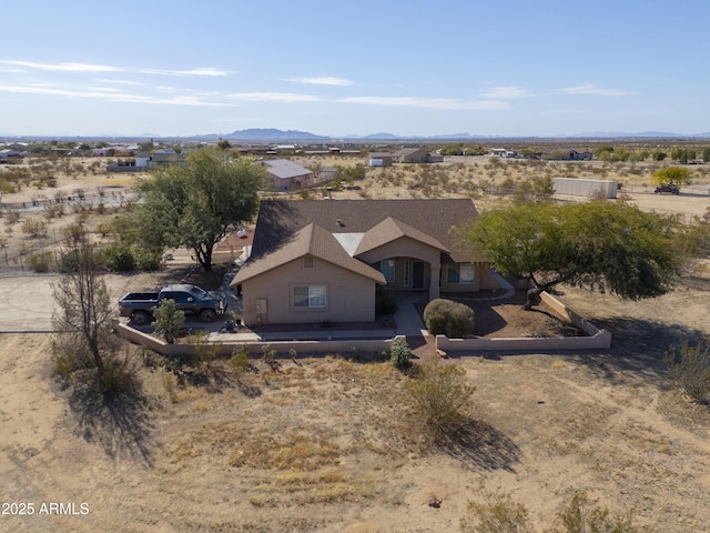 birds eye view of property with a mountain view