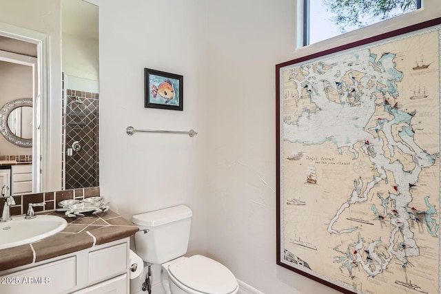 bathroom featuring toilet and vanity