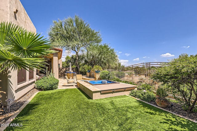 view of yard featuring a patio area, fence, and an outdoor hot tub