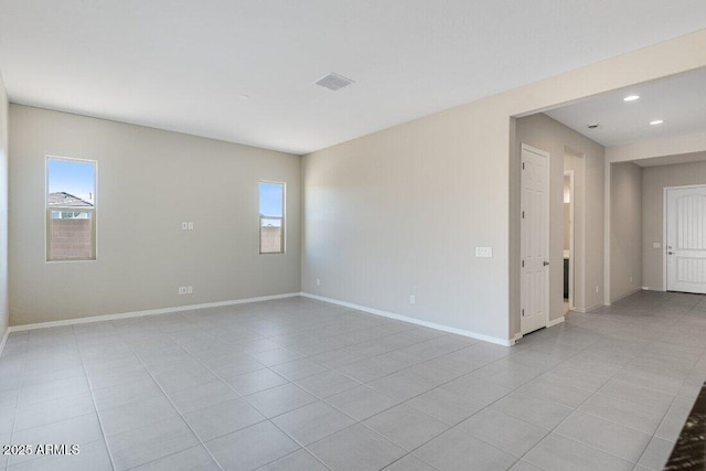 empty room featuring light tile patterned floors