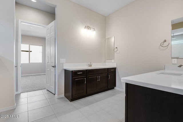 bathroom with tile patterned flooring and vanity