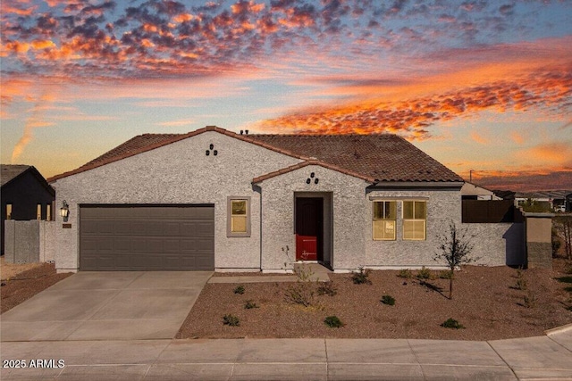 mediterranean / spanish-style home featuring a garage