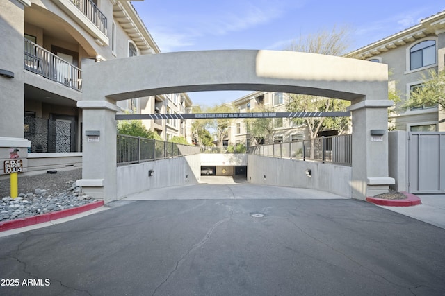 view of car parking featuring fence