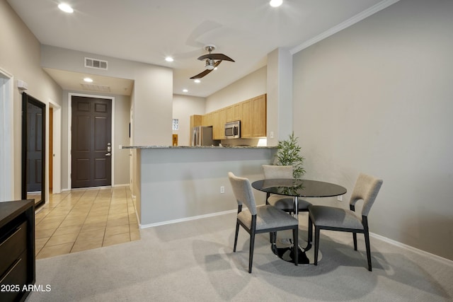 dining room featuring visible vents, recessed lighting, light tile patterned floors, baseboards, and light colored carpet