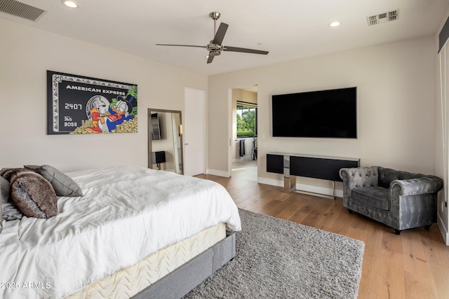 9148 N 66th Pl, Paradise Valley, AZ 85253 - bedroom with wood finished floors, recessed lighting, ceiling fan, and baseboards