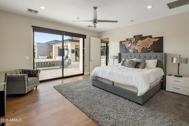 9148 N 66th Pl, Paradise Valley, AZ 85253 - bedroom with access to outside, light wood finished floors, recessed lighting, and a ceiling fan