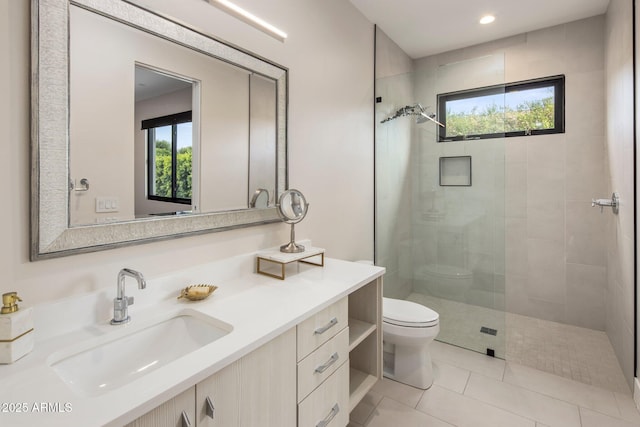 9148 N 66th Pl, Paradise Valley, AZ 85253 - bathroom featuring toilet, a tile shower, vanity, tile patterned flooring, and recessed lighting