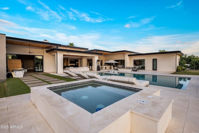 9148 N 66th Pl, Paradise Valley, AZ 85253 - outdoor pool with a hot tub, a patio, a ceiling fan, and exterior kitchen