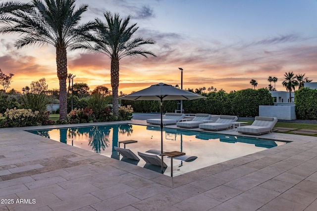 9148 N 66th Pl, Paradise Valley, AZ 85253 - pool at dusk with a patio area and an outdoor pool