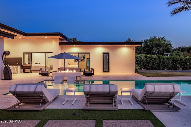 9148 N 66th Pl, Paradise Valley, AZ 85253 - swimming pool with an outdoor living space with a fire pit and a patio area