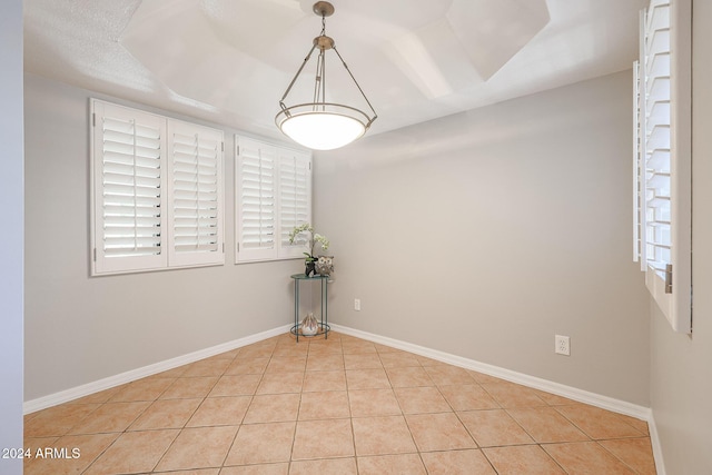 spare room with light tile patterned floors