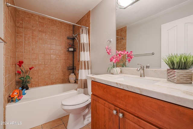 full bathroom with vanity, tile patterned floors, toilet, a textured ceiling, and shower / tub combo