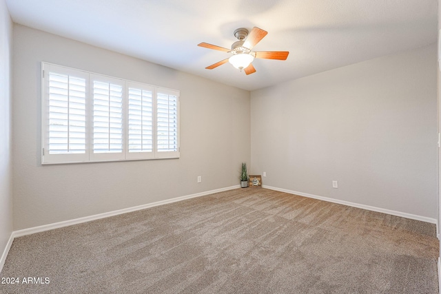 unfurnished room featuring carpet flooring and ceiling fan