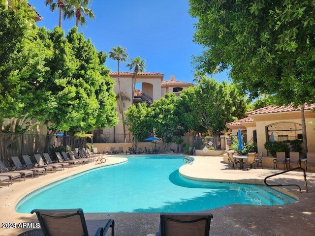 view of swimming pool with a patio area