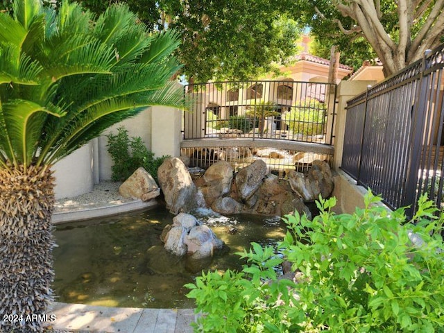 exterior space featuring a small pond