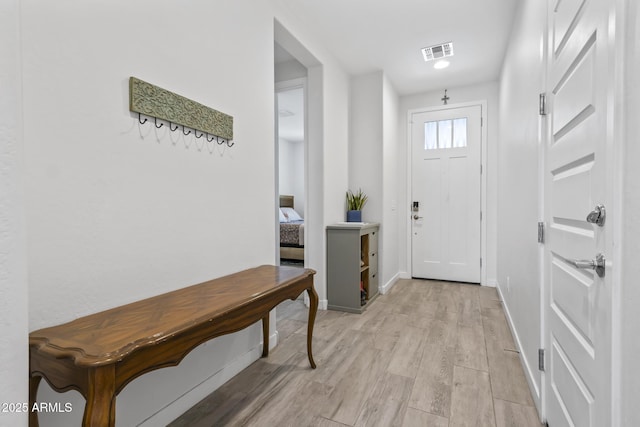 6919 S 13th Pl, Phoenix, AZ 85042 - entryway featuring light wood-style floors and baseboards