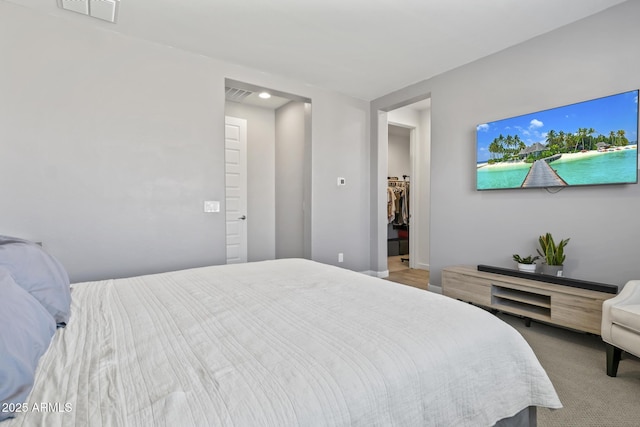 6919 S 13th Pl, Phoenix, AZ 85042 - carpeted bedroom with a walk in closet and recessed lighting