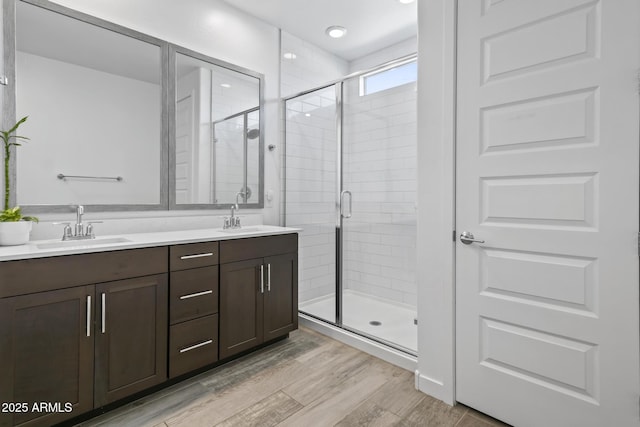 6919 S 13th Pl, Phoenix, AZ 85042 - full bath with double vanity, a stall shower, and wood finished floors