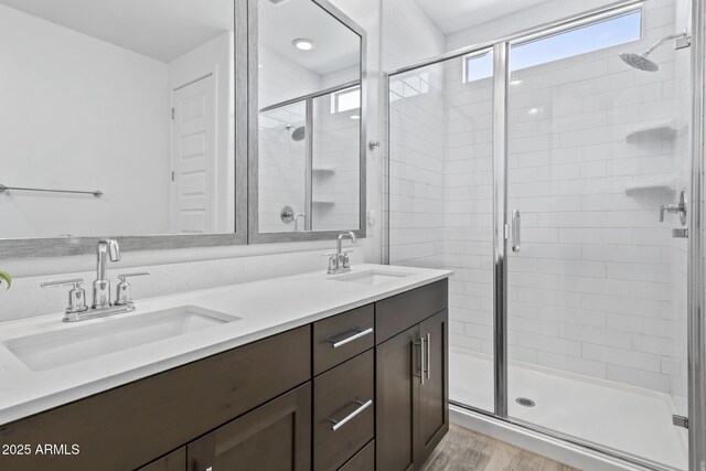 6919 S 13th Pl, Phoenix, AZ 85042 - bathroom with a shower stall, double vanity, and wood finished floors