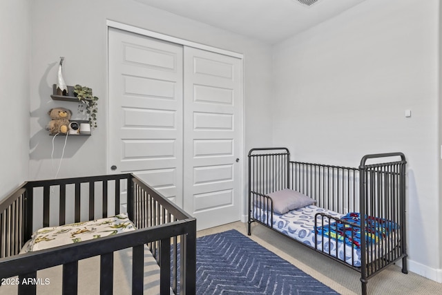 6919 S 13th Pl, Phoenix, AZ 85042 - carpeted bedroom with a closet and a crib