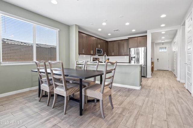 6919 S 13th Pl, Phoenix, AZ 85042 - dining area featuring light wood-style flooring and recessed lighting