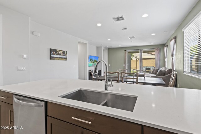 6919 S 13th Pl, Phoenix, AZ 85042 - kitchen with dishwasher, open floor plan, light countertops, recessed lighting, and dark brown cabinets