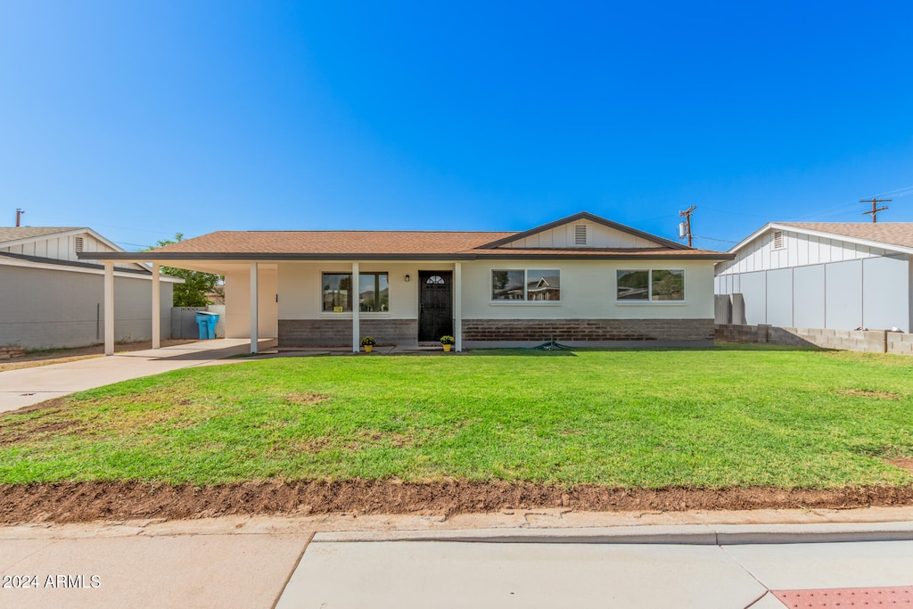 ranch-style house with a front yard